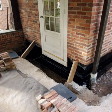 Interior brick leaf is waterproofed down to foundation