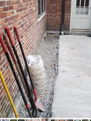 Inside edge of concrete base is removed and brick wall removal is about to begin