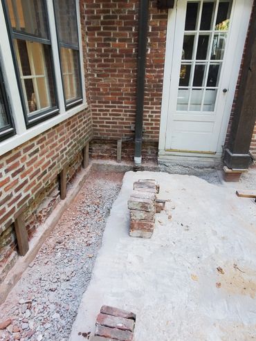 Inside corner brickwork is removed and shored