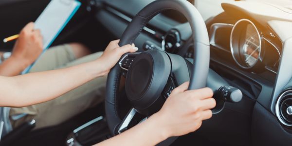 Driving lesson with the student at the wheel and the instructor on the passenger's seat 2