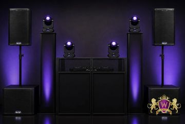 Professional DJ setup with speakers and lighting.