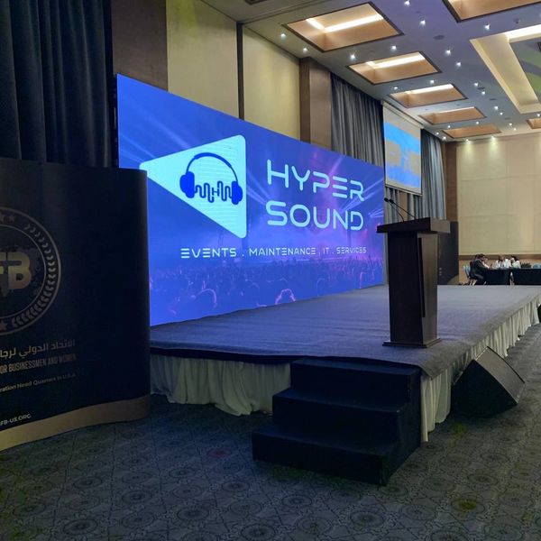 Stage setup with Hyper Sound branding for events and IT services.