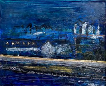 Abstract nightscape with buildings under a deep blue sky.