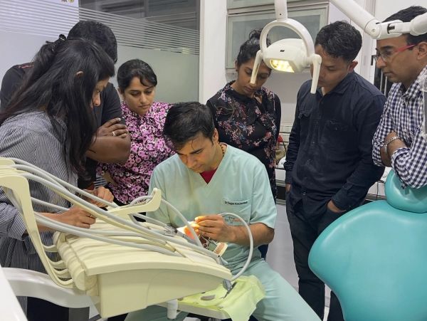 Dr Sagar Abichandani explaining smile makeover, dental implant and full mouth rehabilitation plannin
