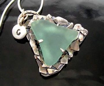 Custom natural sea glass and sterling silver commissioned pendant reflect life's turbulent struggles