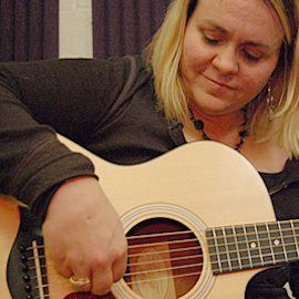 Maria at the guitar.