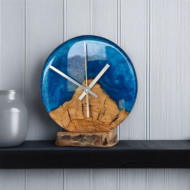 Resin and olive wood desktop clock with mountain silhouette design.