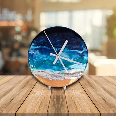 ocean desktop clock with blue resin layers and golden beach on metal stand.