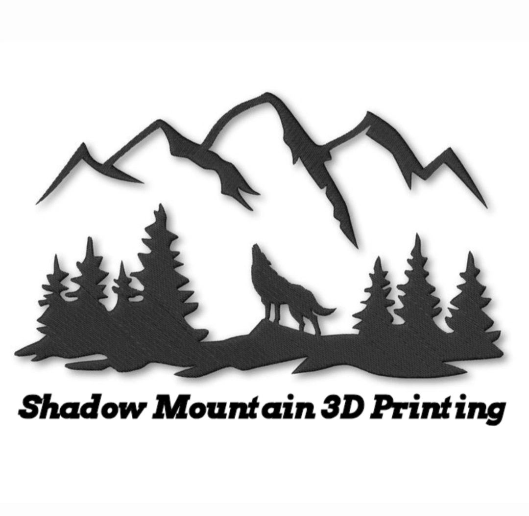 Black silhouette logo of mountains, trees, and a howling wolf with text Shadow Mountain 3D Printing.