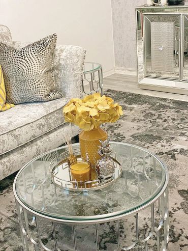 Elegant living room with silver and yellow decor accents.