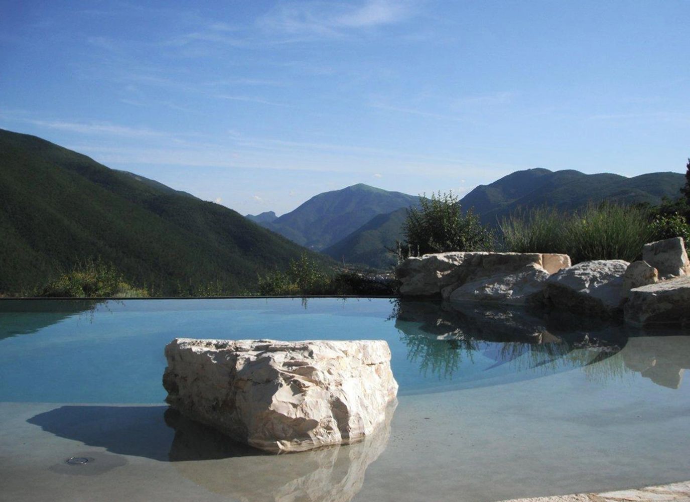 Swimming pool and mountain view at Geppa
