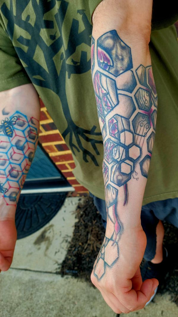 Geometric tattoo bee , hexagon honeycomb spiral on hand under organic tree