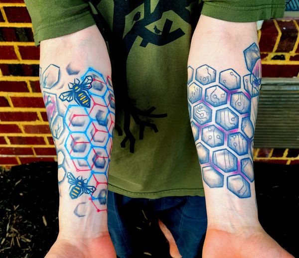 Geometric tattoo bee , hexagon honeycomb spiral on hand under organic tree