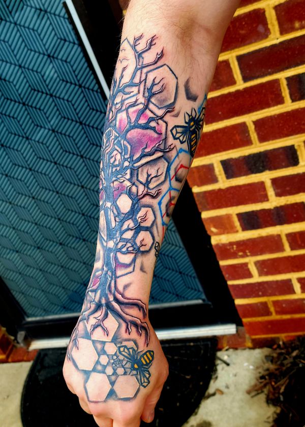 Geometric tattoo bee , hexagon honeycomb spiral on hand under organic tree