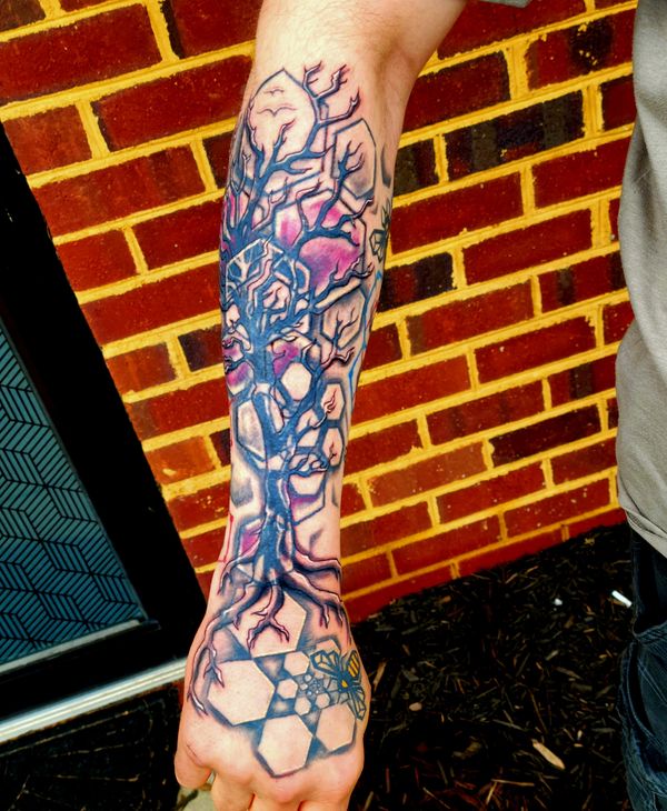Geometric tattoo bee , hexagon honeycomb spiral on hand under organic tree