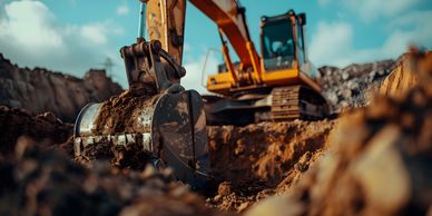 Image of excavator machine moving dirt on a civil excavation job