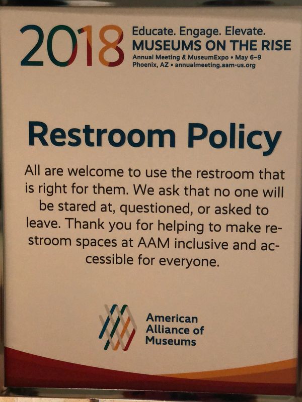 Restroom policy on a blown color poster image