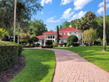 Tile roof replacement on a Lake Mary, FL home with a brick paver driveway