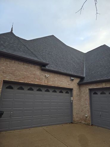 GUTTERS AND GARAGE DOOR PAINTED