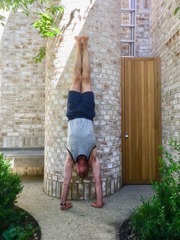 Adho Mukha Vrksasana (full arm balance) against the wall