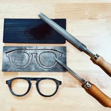Buffalo horn plates, a file and a scraper and a drawing of a bespoke frame
