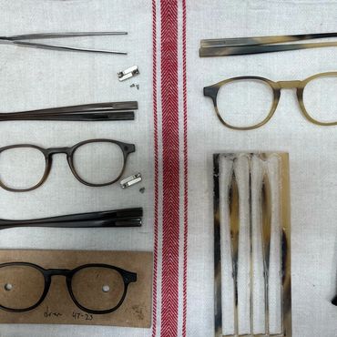 frames and temples in the process some raw horn material, hinges and screwdrivers.