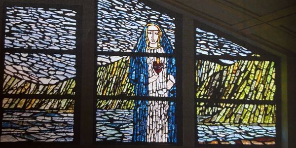 The Blessed Mother amidst the landscape of the Pali