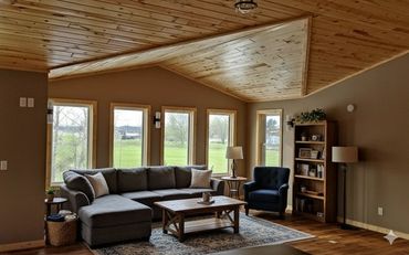 Custom timber framing and open-concept vaulted ceiling installation in Cormorant, MN.