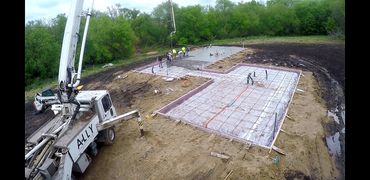 Structural slab foundation preparation and concrete pumping for a new custom build in Vergas, MN.