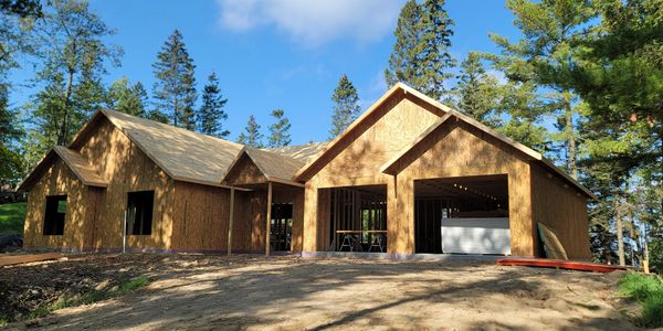 Precision framing and structural phase of a large lakeside custom home build in Minnesota.