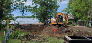 Lakefront site preparation, excavation, and shoreline grading in Pelican Rapids, MN.
