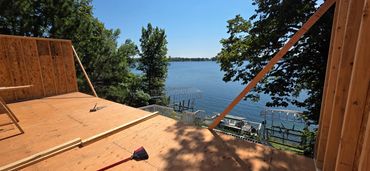 Premium lakeside residential framing and structural deck subfloor installation in Lake Park, MN.