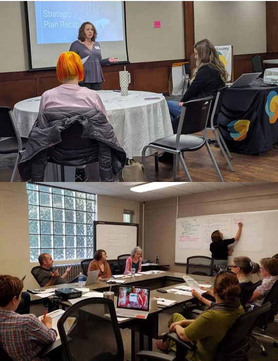 Facilitator leading a group of people in strategic planning