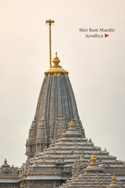The ornate spire of Shri Ram Mandir in Ayodhya, with intricate stone carvings and golden accents.