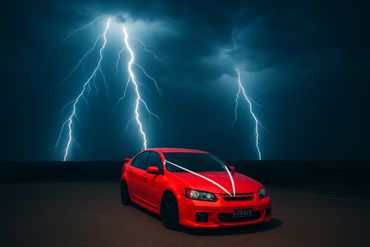 Red car parked under a stormy sky with lightning bolts.