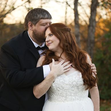 Photo of newlyweds embracing during golden hour photos at the Homeplaces at Johnston Farms.