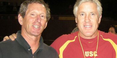 Two men one in black and another is in red t shirt