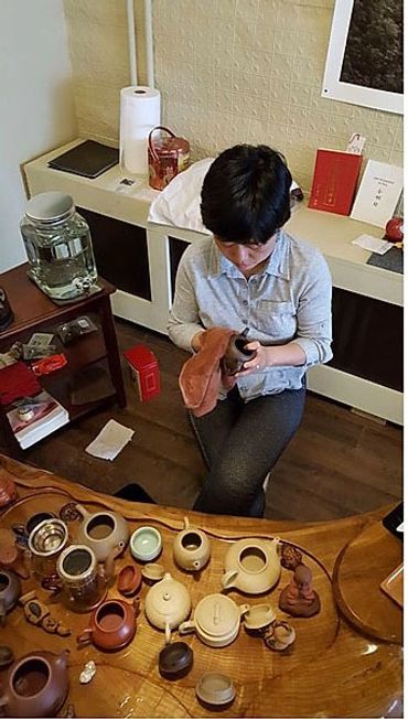Cleaning the teapots.