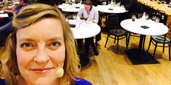 A speaker waiting for attendees to arrive at a tasting