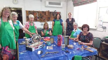 Ladies at Workaid in Chesham showing off their decoupaged crafts
Craft social art and craft workshop