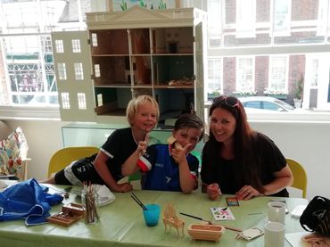 Mother and children at Amersham Museum taking part in a family craft workshop