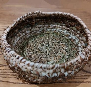 Hand made basket created from foraged plants