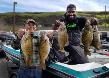 Two Columbia River Bassmaster members with a limit of big smallmouth bass at Celilo Park, Oregon.