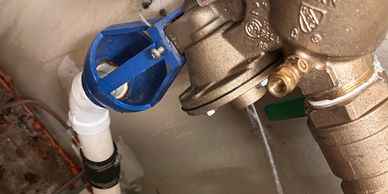 Water leaking from a valve connected to pipes.