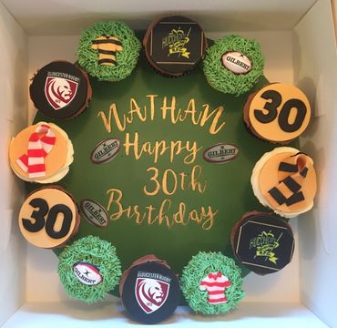 Sports themed cupcake board birthday
celebration rugby