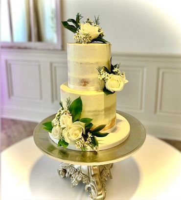 Semi-naked wedding cake with white roses