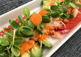 Sunflower Avocado and Tomato Appetizer with Desert Micro sunflower and a light olive oil dressing.