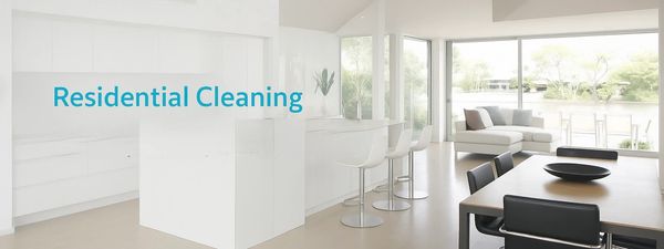 Bright, clean modern kitchen and living room promoting residential cleaning services.
