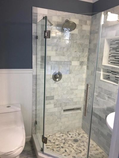 Custom Shower stall ,home made shower pan ,frameless glass enclosure with marble subway tiles