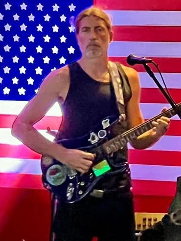 A Photograph of Urck Scott performing at Big T's Saloon in Garden City, South Carolina.